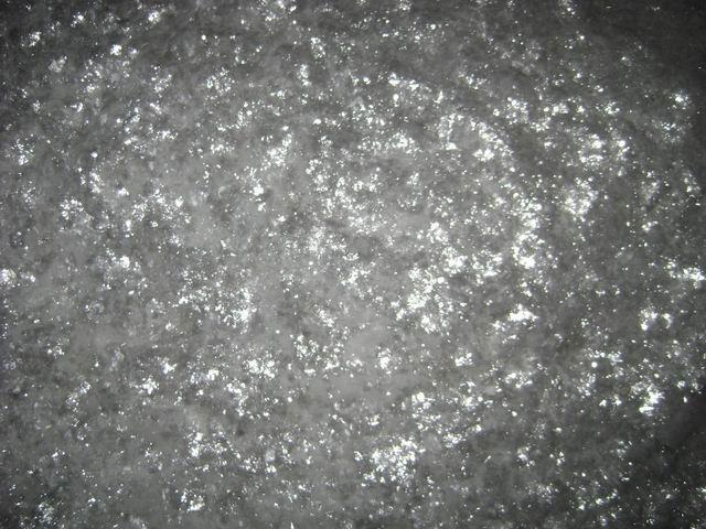 C-28 bulk sample — coarse glass flake showing characteristic light-grey colour and flat lamellar form